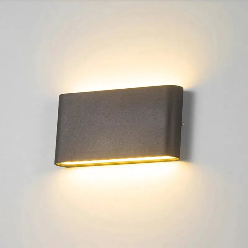 LED wall lamp, rectangular gray aluminum outdoor light with warm glow up and down.