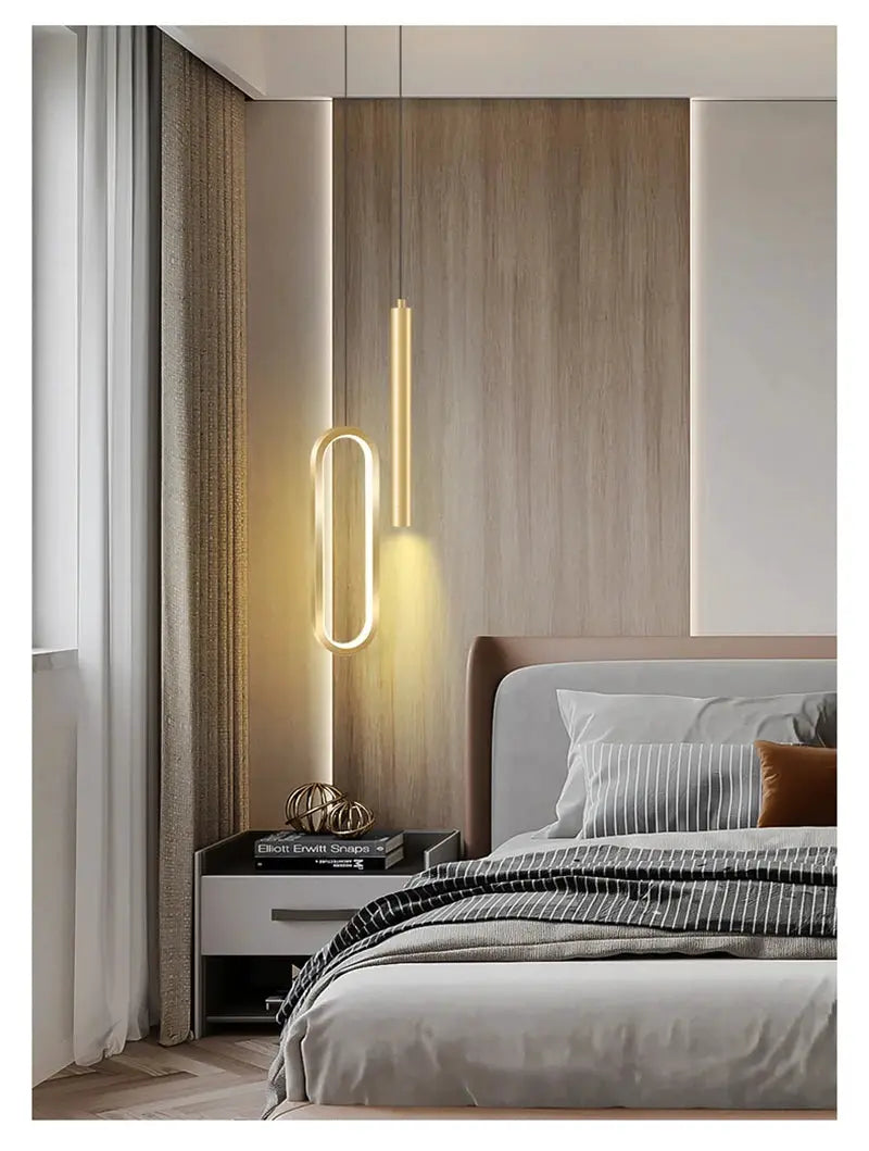 Nordic LED pendant light set with oval loop and vertical bar in warm gold finish, ideal for bedroom.