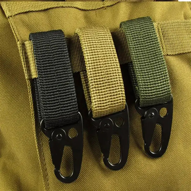 Carabiner key hook set with three nylon MOLLE straps in black, tan, and olive on khaki fabric