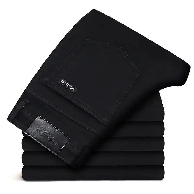 Men's black denim jeans with back pocket, soft stretch; five stacked pairs by Simples Market