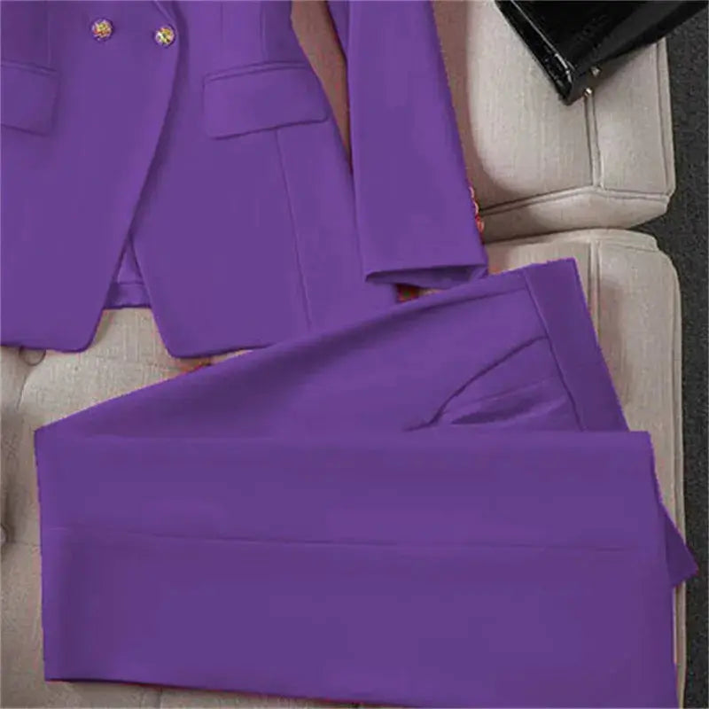Purple two-piece blazer pants suit for women by Simples Market, long-sleeve jacket with gold buttons.