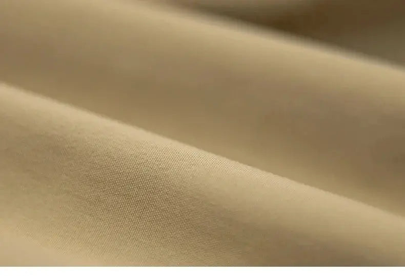 Maden Hooded Down Jacket fabric close-up in beige; smooth matte finish