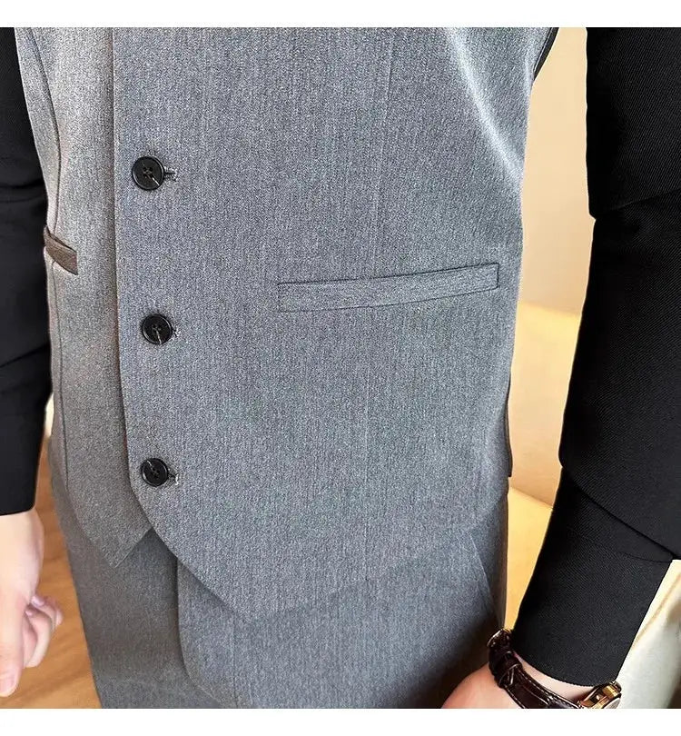 Simples Market gray elastic waistcoat vest with four black buttons and welt pocket under a black-sleeve jacket