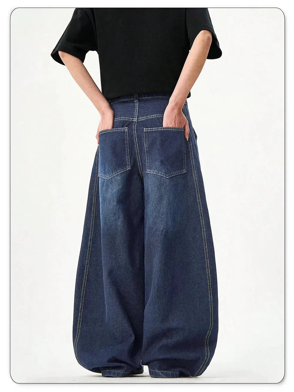 Men's blue denim wide-leg balloon jeans with large back pockets, baggy fit