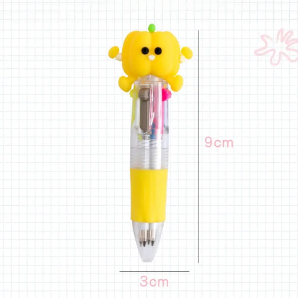 Cute pumpkin-shaped yellow topper on a four-color kids' pen with clear barrel and colorful ink