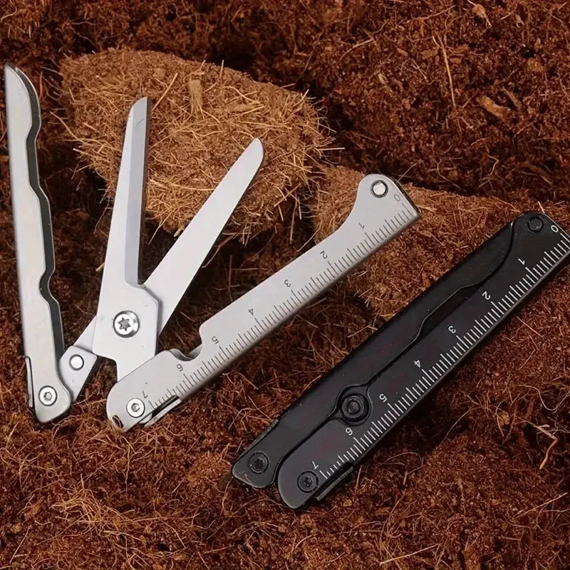 Portable multifunctional folding scissors set of 4 tools in stainless steel with a black case by Simples Market