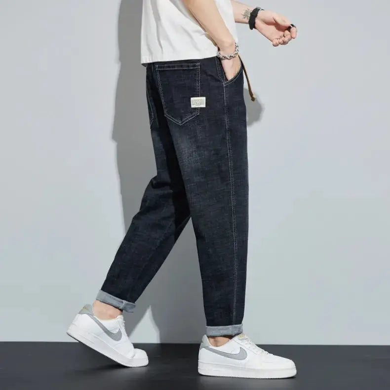 Simples Market men's dark blue denim jeans, loose straight fit with rolled cuffs and back pocket label.