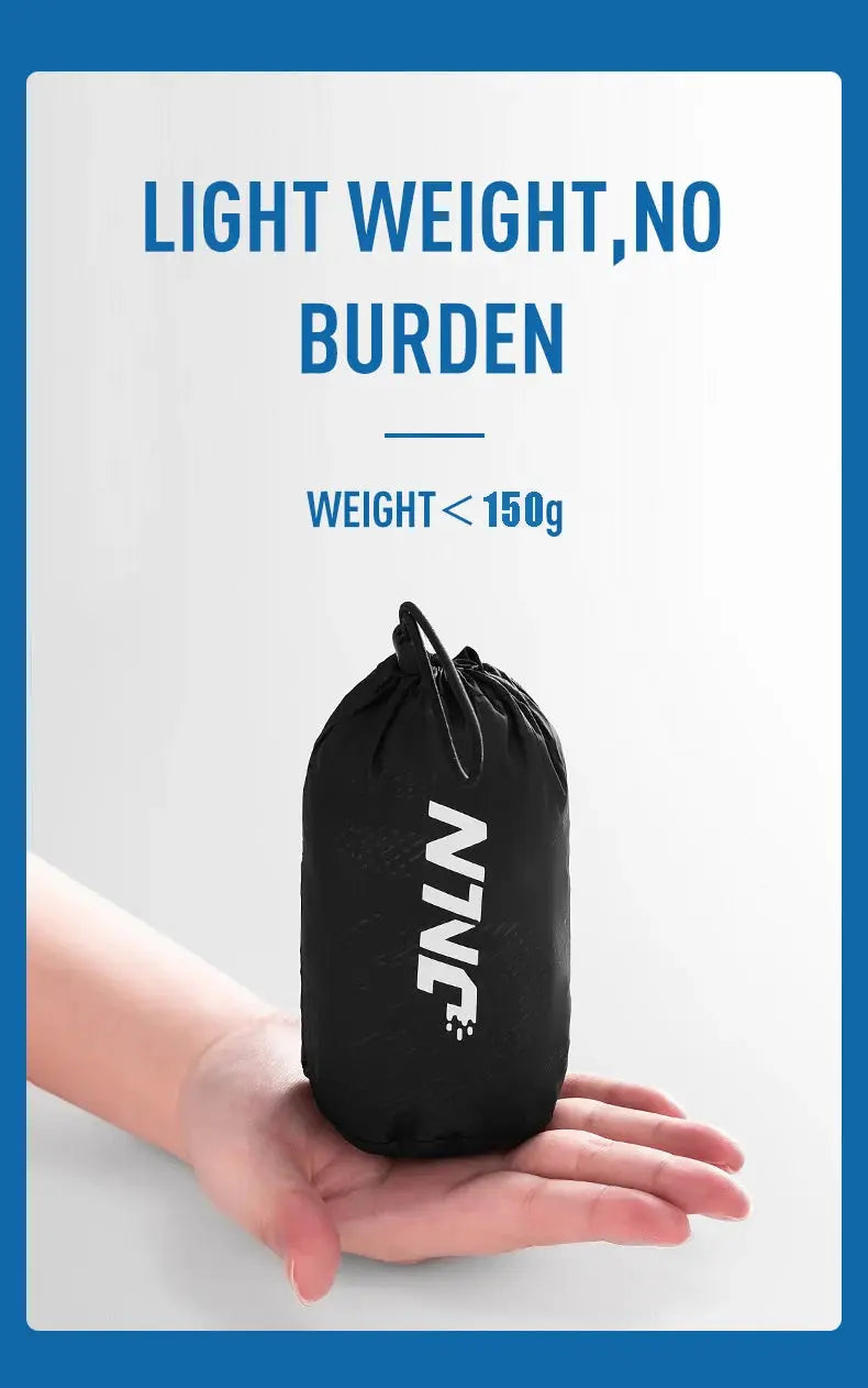Packable hiking pants pouch in black with LNGN logo, held in a hand