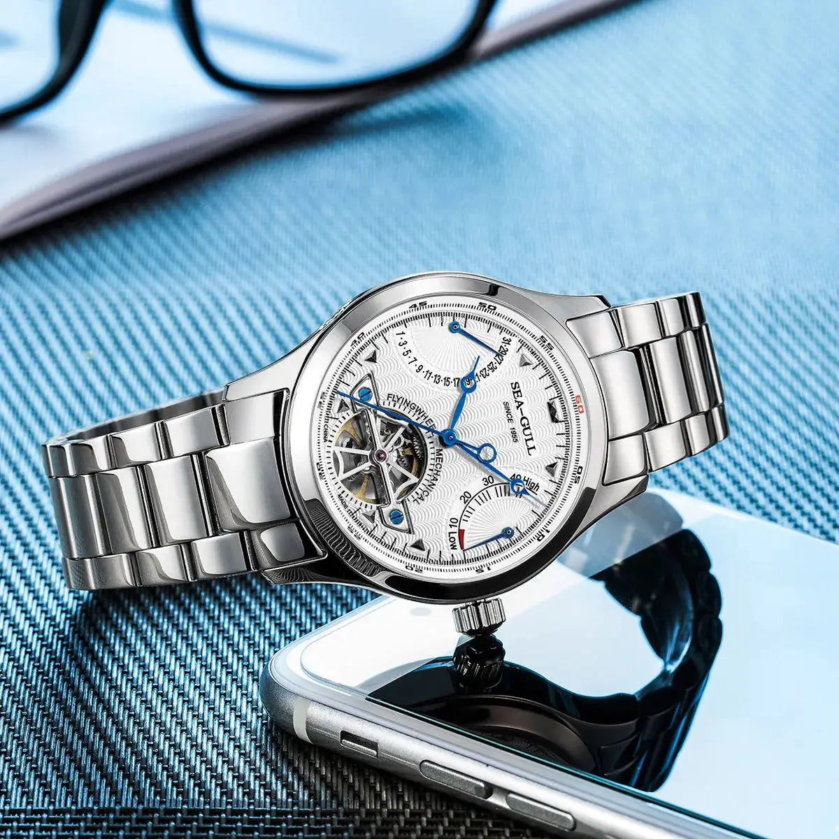 Seagull stainless steel watch with blue hands and open-heart skeleton dial, multifunction calendar