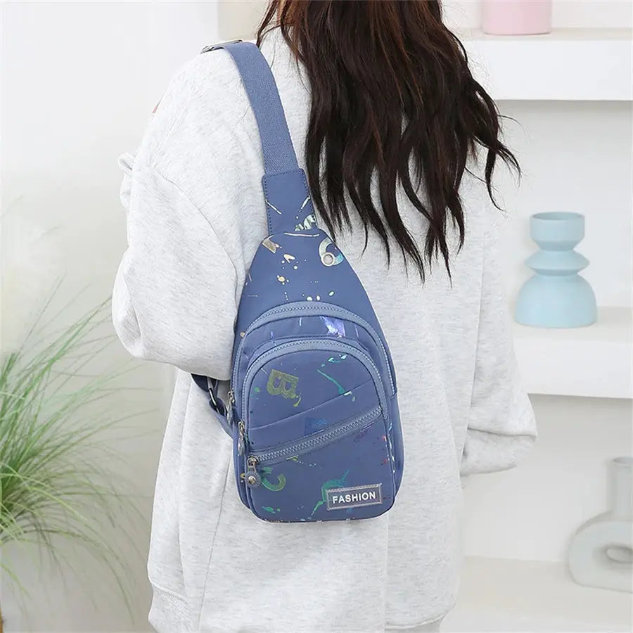 Blue chest bag crossbody sling backpack for women with front zip pockets, small size