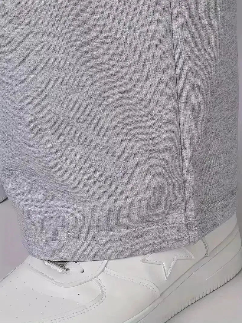 Men's gray straight-leg sweatpants by Simples Market, casual fit, paired with white sneakers.