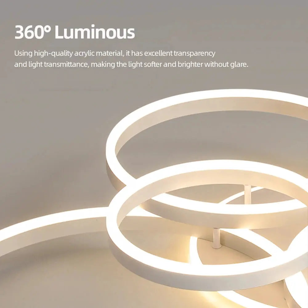 Modern LED ceiling chandelier with white circular rings, dimmable indoor lighting.
