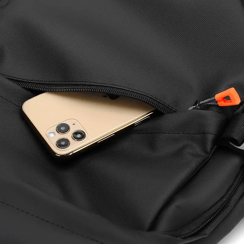 Luxury men's black nylon backpack for 15.6-inch laptops with front zip pocket and orange zipper pull