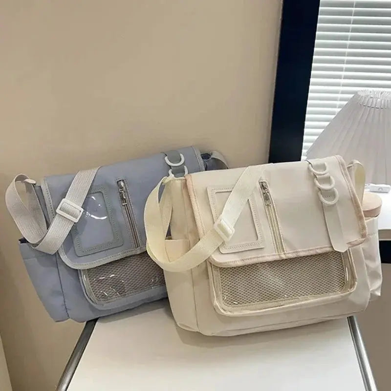 Itabag shoulder bags by Simples Market; two transparent beige and blue bags with mesh pockets.