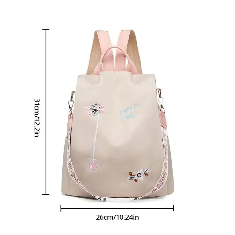 Simples Market waterproof Oxford women backpack with pink straps, beige body and floral embroidery.