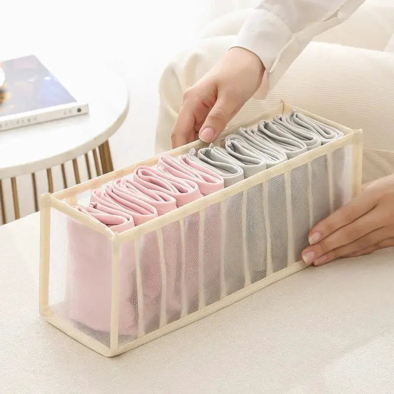11-compartment collapsible underwear storage box with breathable mesh; pink and gray underwear neatly stored.
