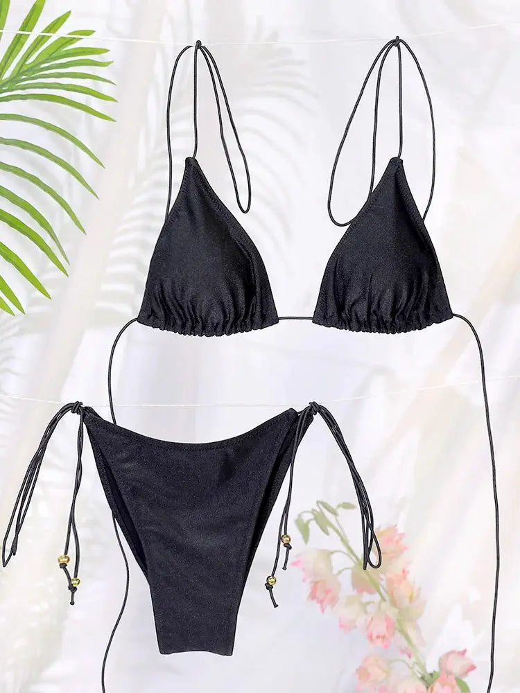 Black two-piece string bikini set with triangle top and high-cut bottom, beaded side ties