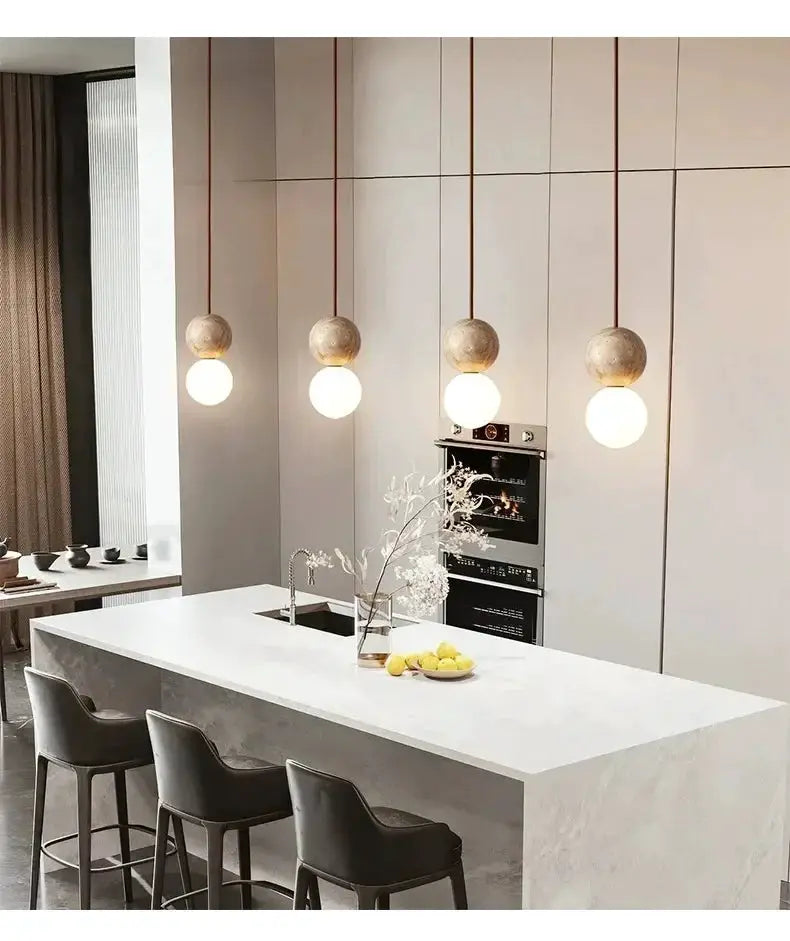 Led pendant light set with stone cream spherical shades, four hanging luminaires over a kitchen island