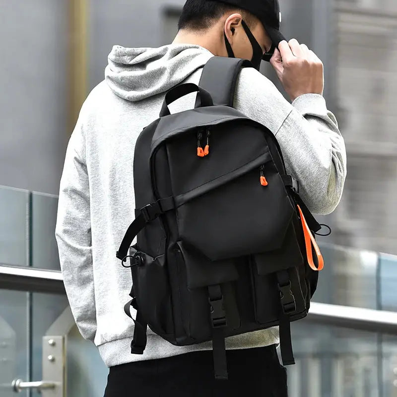 Black luxury men's backpack with orange zipper pulls, 15.6-inch laptop backpack for travel and school