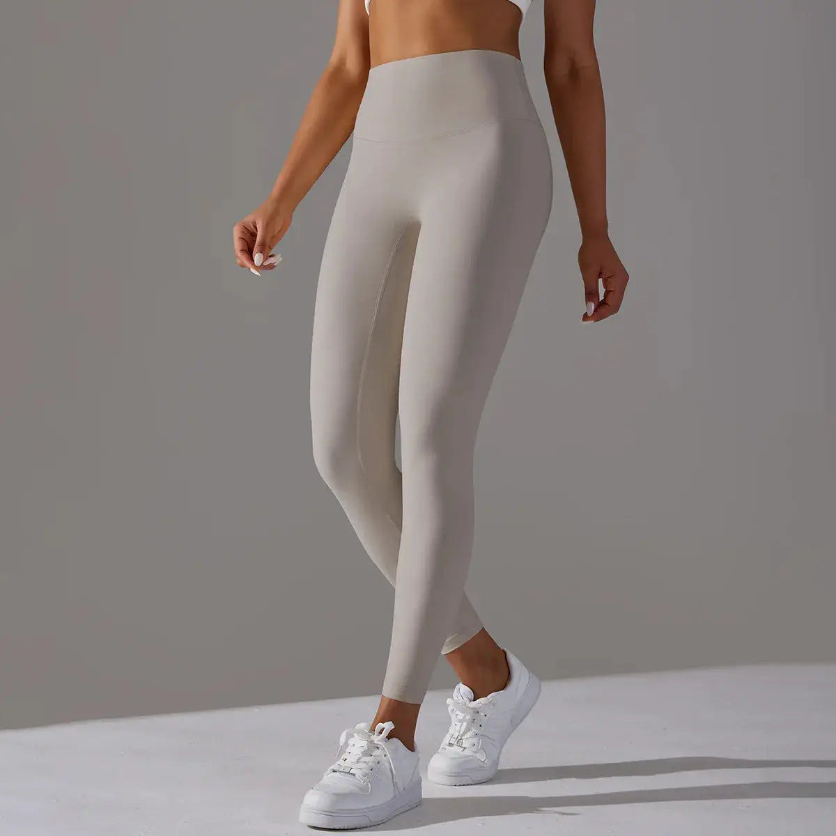 High waist naked-feeling leggings for women; beige gym/yoga pants with a tight, supportive fit