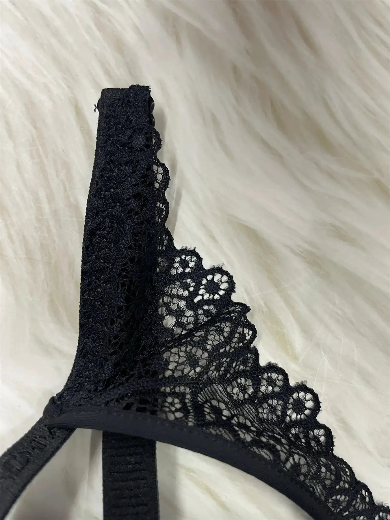 Black lace bralette with scalloped edges and elastic band