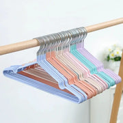 Plastic hangers by Simples Market in pastel colors with metal hooks, anti-slip and space-saving