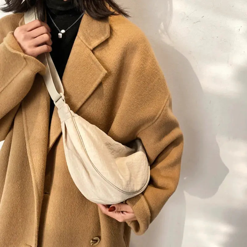 Crossbody bag beige crescent-shaped padded nylon fabric with white strap