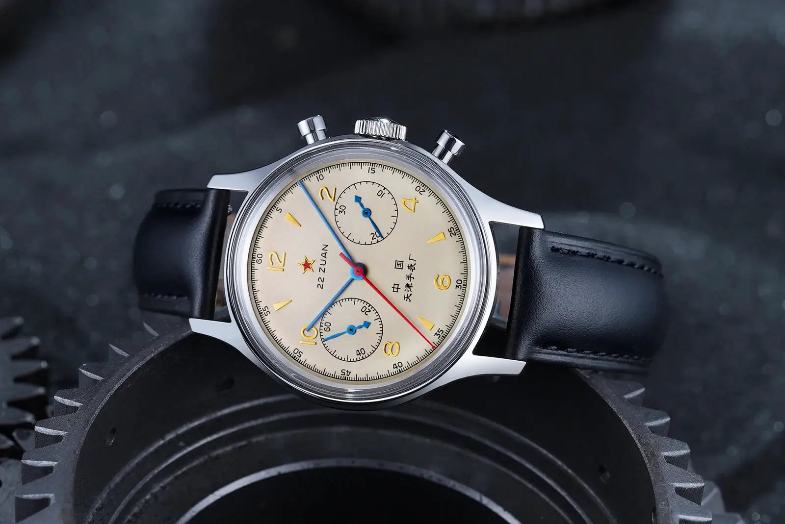Seagull 1963 mechanical chronograph watch on black leather strap with beige dial, gold numerals, blue subdial hands
