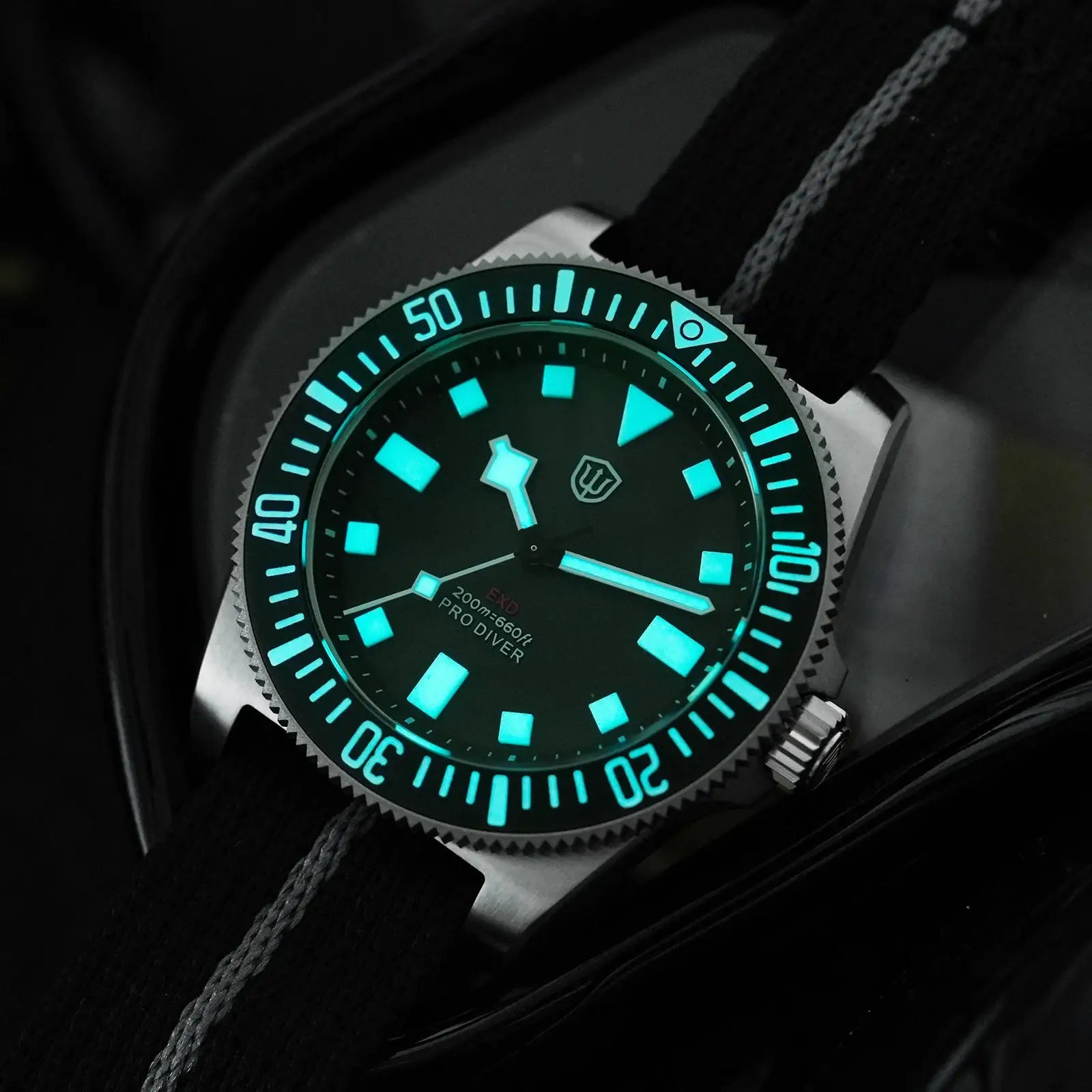 Watchdives EXD 40mm titanium dive watch with teal luminous markers, sapphire crystal, 200m water resistance, black strap