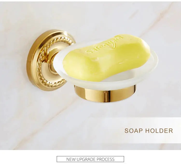 Soap holder by Simples Market; gold brass, wall-mounted bathroom accessory with a yellow soap