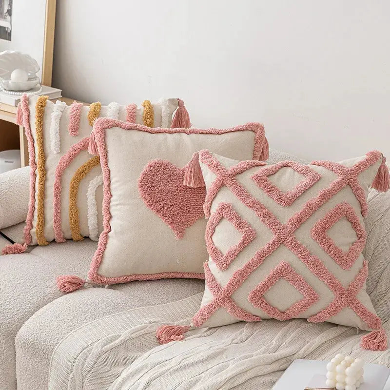 Pillow covers set of 3: pink cotton tufted with tassels on beige sofa cushions