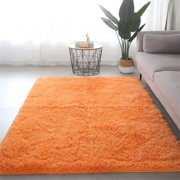 Fluffy orange shag area rug by Simples Market, ultra-soft and plush for living room decor.