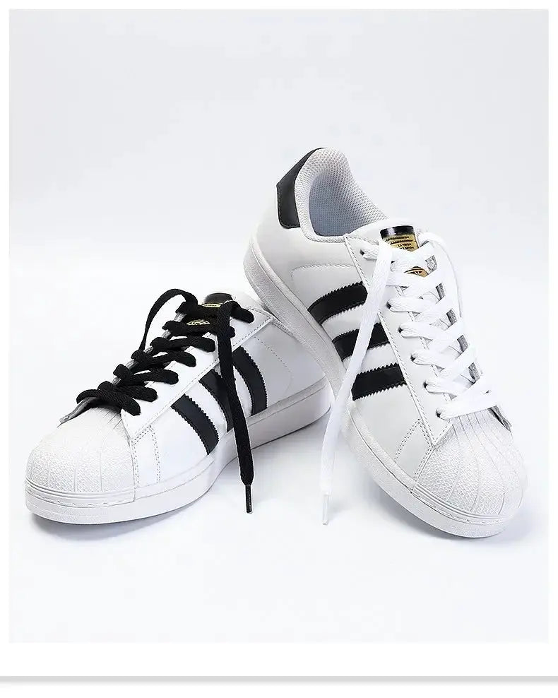 Flat shoelaces, 1 pair, black and white laces shown on sneakers; unisex casual shoe strings