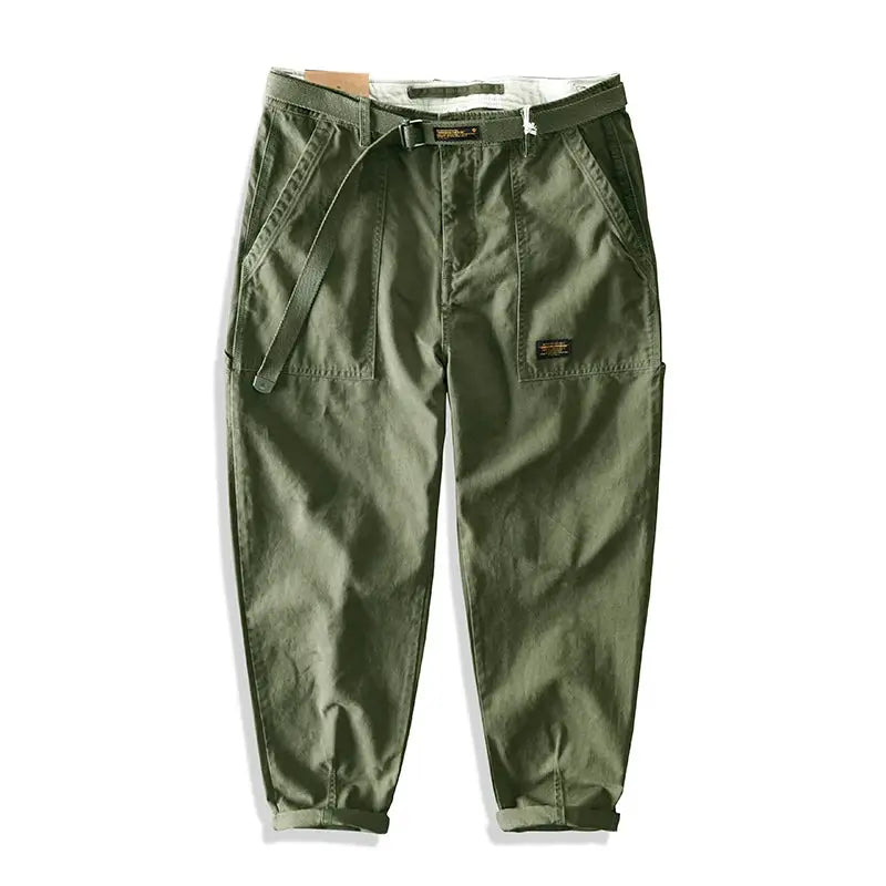 Cargo pants for men in olive green by Simples Market; belt, cargo pockets, and rolled cuffs.