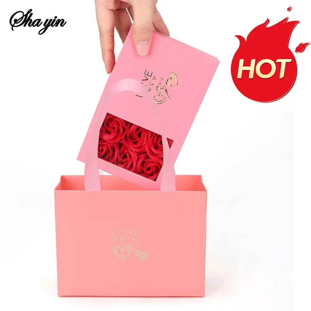 Jewelry gift set, two-piece, in pink with rose-window display and matching pink gift bag filled with red roses