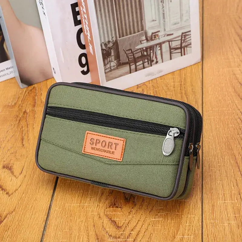 Men's olive green nylon waist pack with front zip pocket and dual zippers
