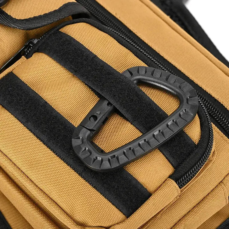 Simples Market outdoor tactical chest bag in tan with black straps and rugged plastic D-ring buckle.