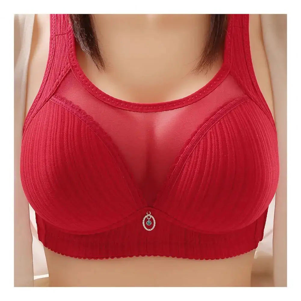 Red wireless bra with wide straps, ribbed cups, and center pendant charm