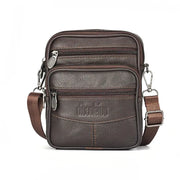 Men's brown genuine leather crossbody bag with multiple zip pockets and adjustable strap.