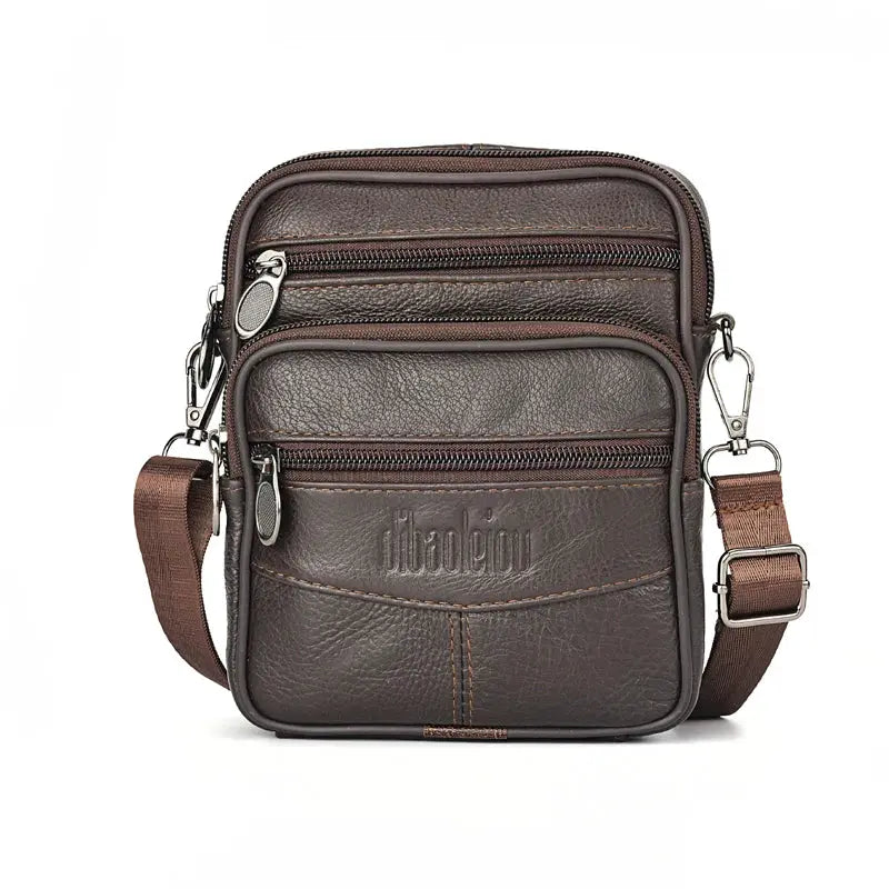Men's brown genuine leather crossbody bag with multiple zip pockets and adjustable strap.