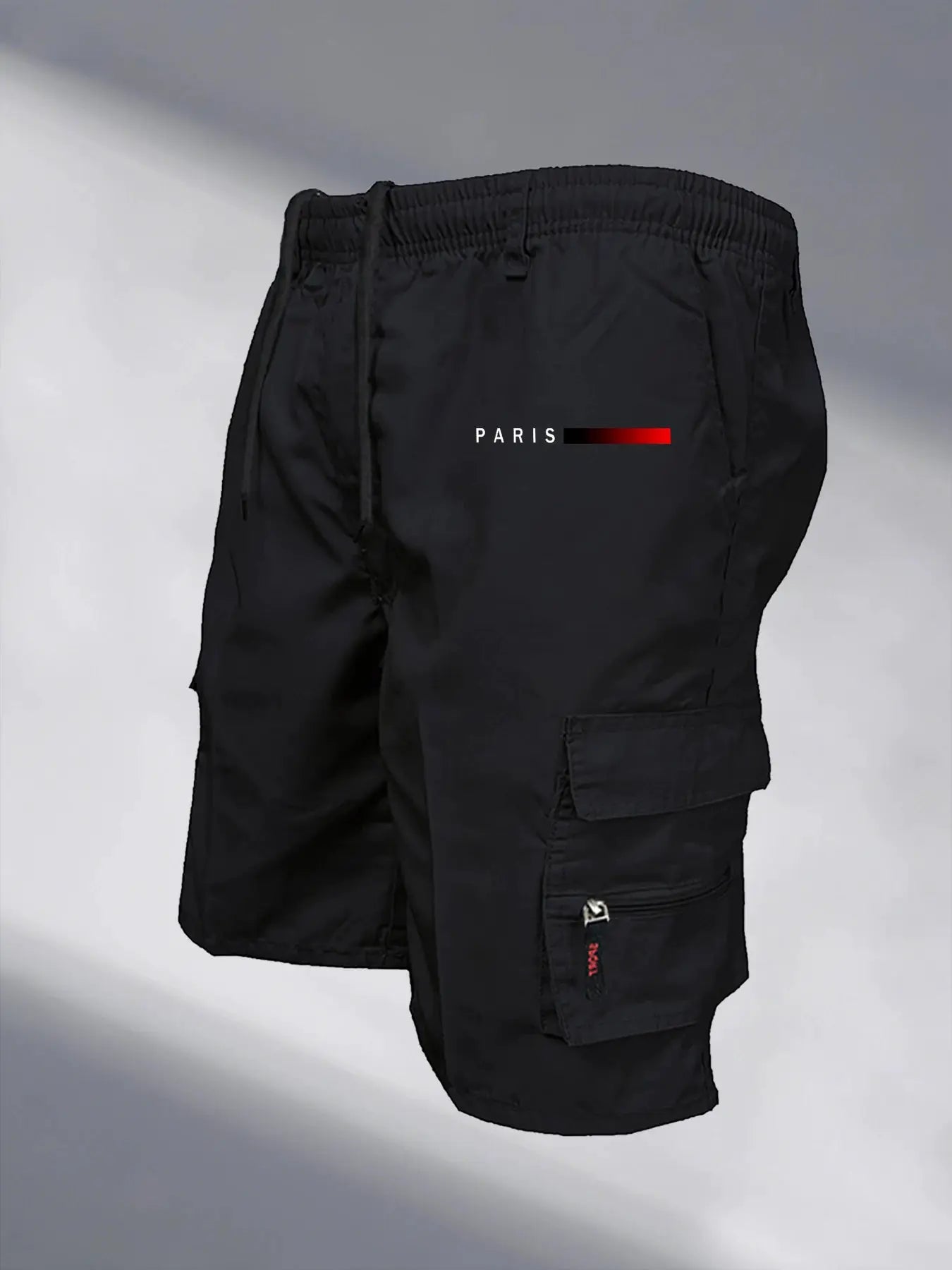 Men's black tactical cargo shorts with elastic waistband and zip pockets.
