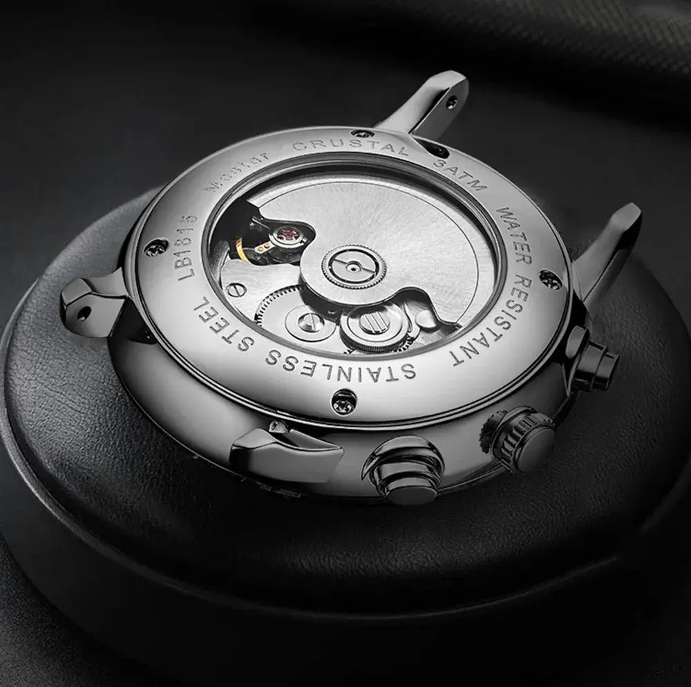 Men's stainless steel mechanical wristwatch with transparent case back and visible movement