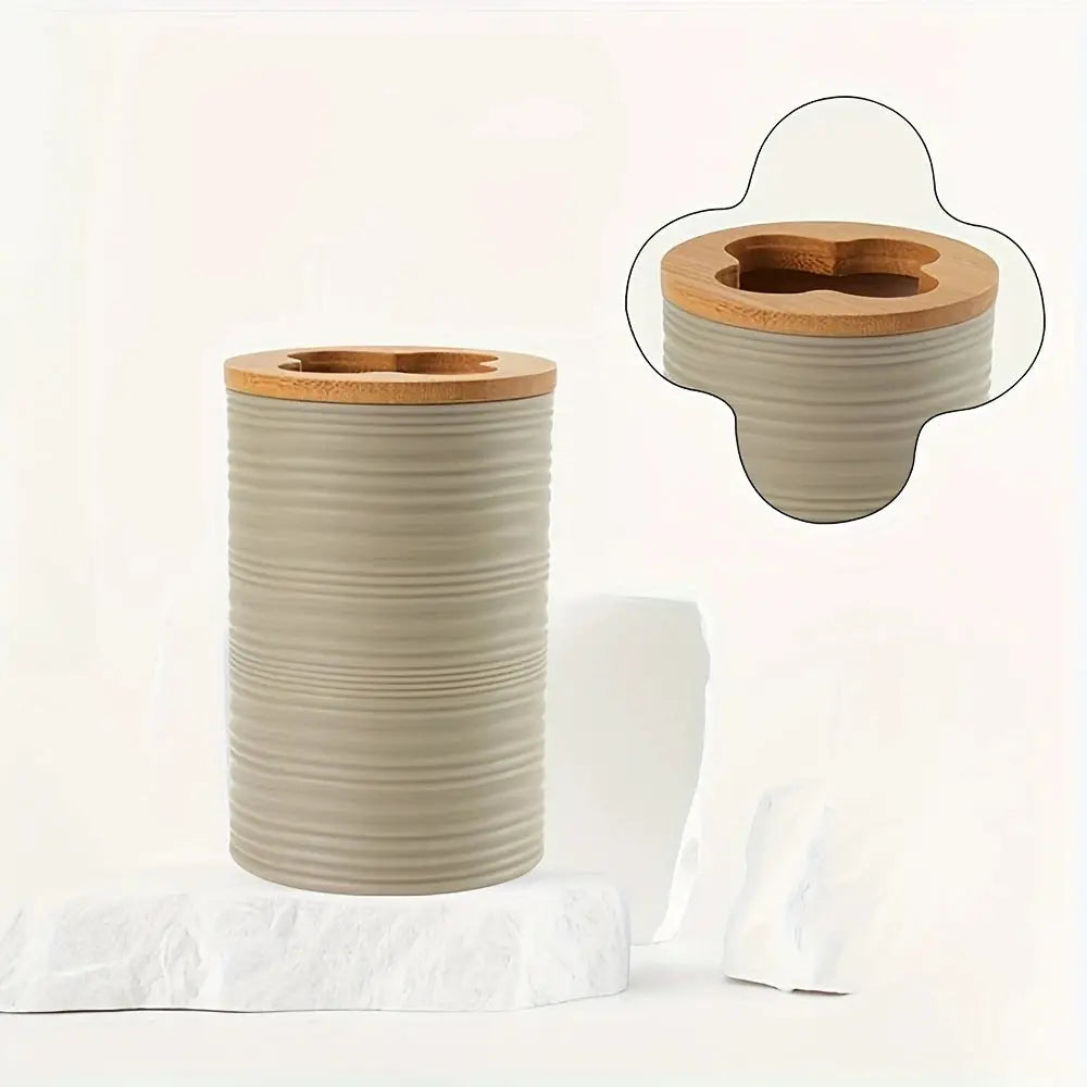 Toothbrush holder; ribbed beige ceramic with a wooden top.