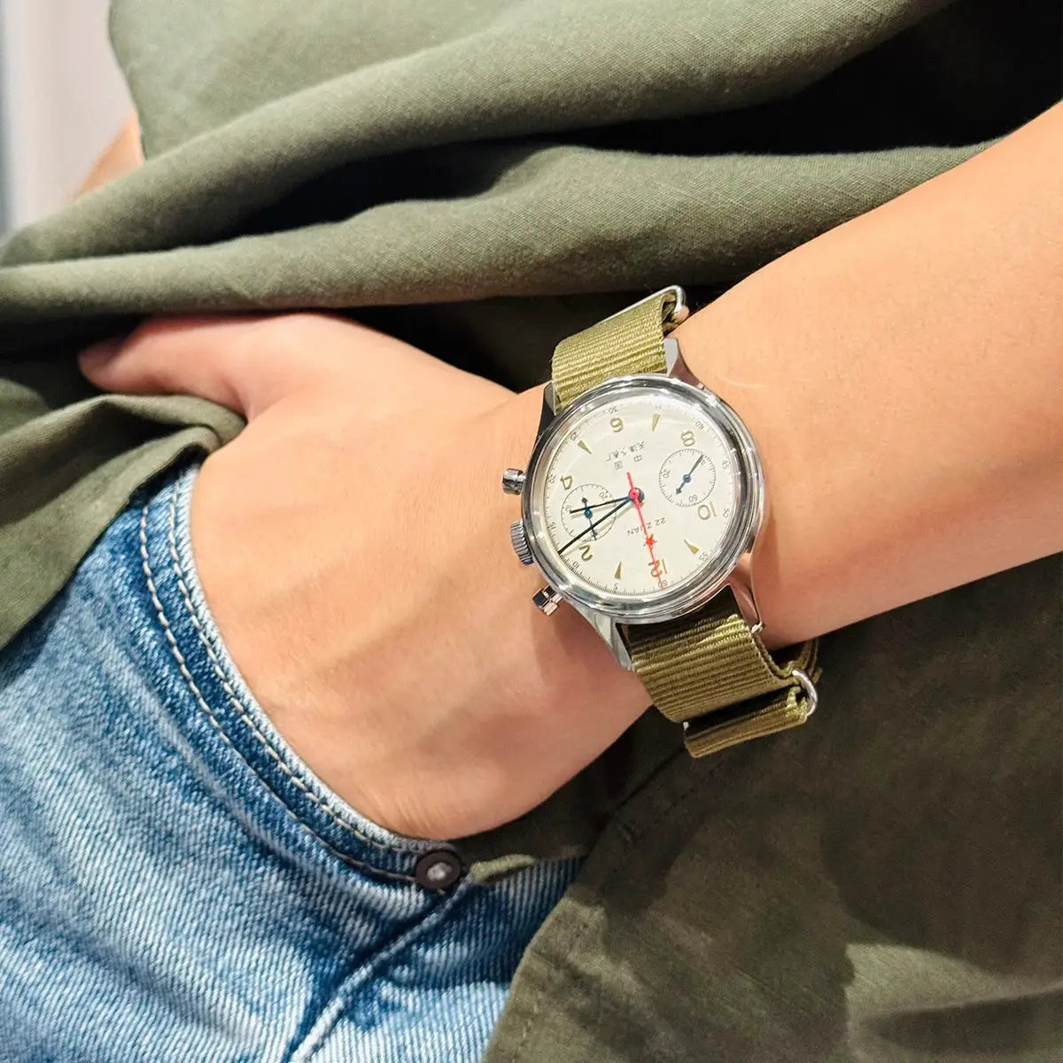 Seagull 1963 International Edition men's watch on olive canvas strap with stainless steel case.