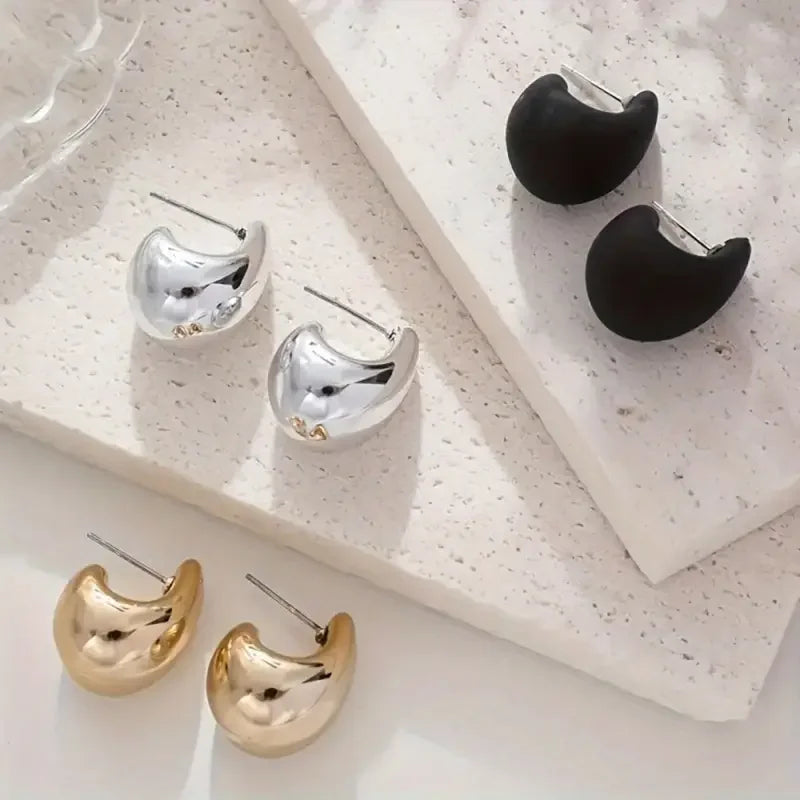 Teardrop stud earring set featuring silver, gold, and black crescent styles; lightweight chic fashion jewelry, 3 pairs.