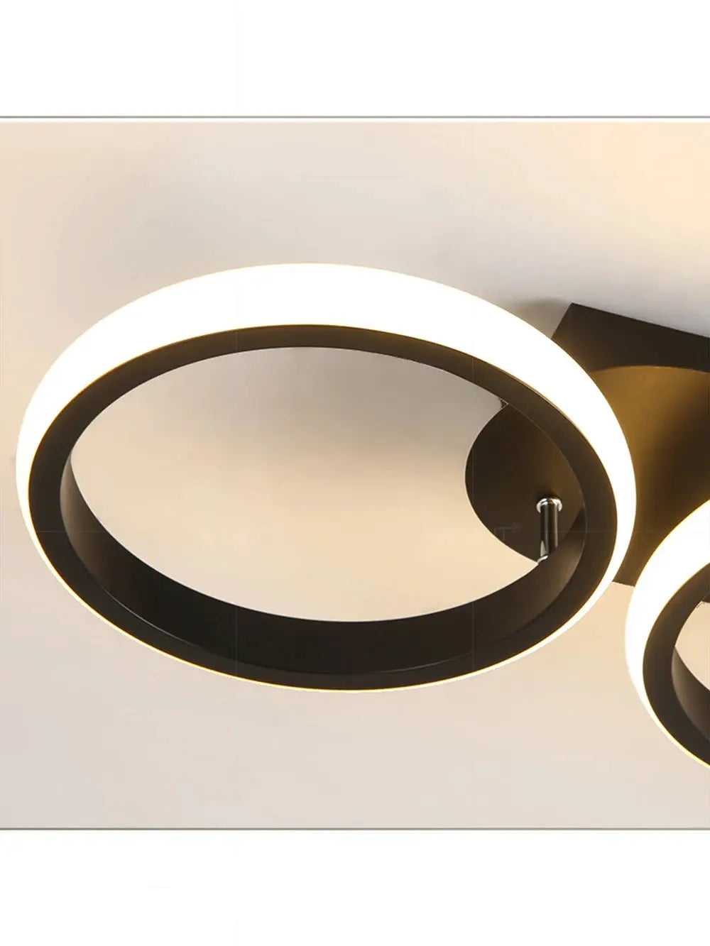 LED ceiling light dual-ring fixture, modern black metal rings with warm white glow