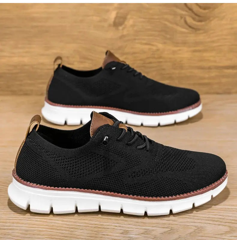 Men's black mesh sneakers by Simples Market, brown heel accents, white chunky soles; 2 pairs shown