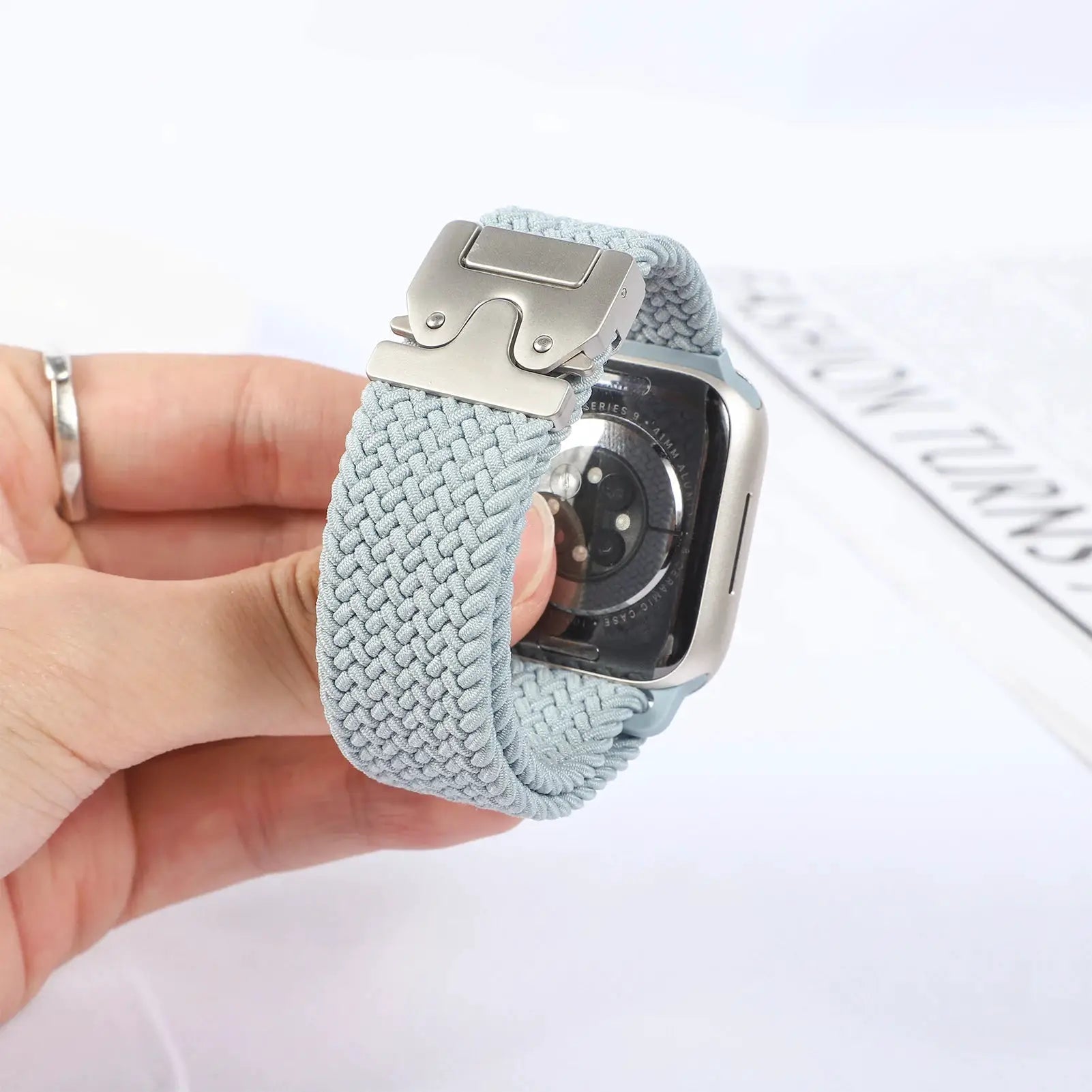 Parachute braided Apple Watch strap, light blue nylon, for 41–46mm Apple Watch models.