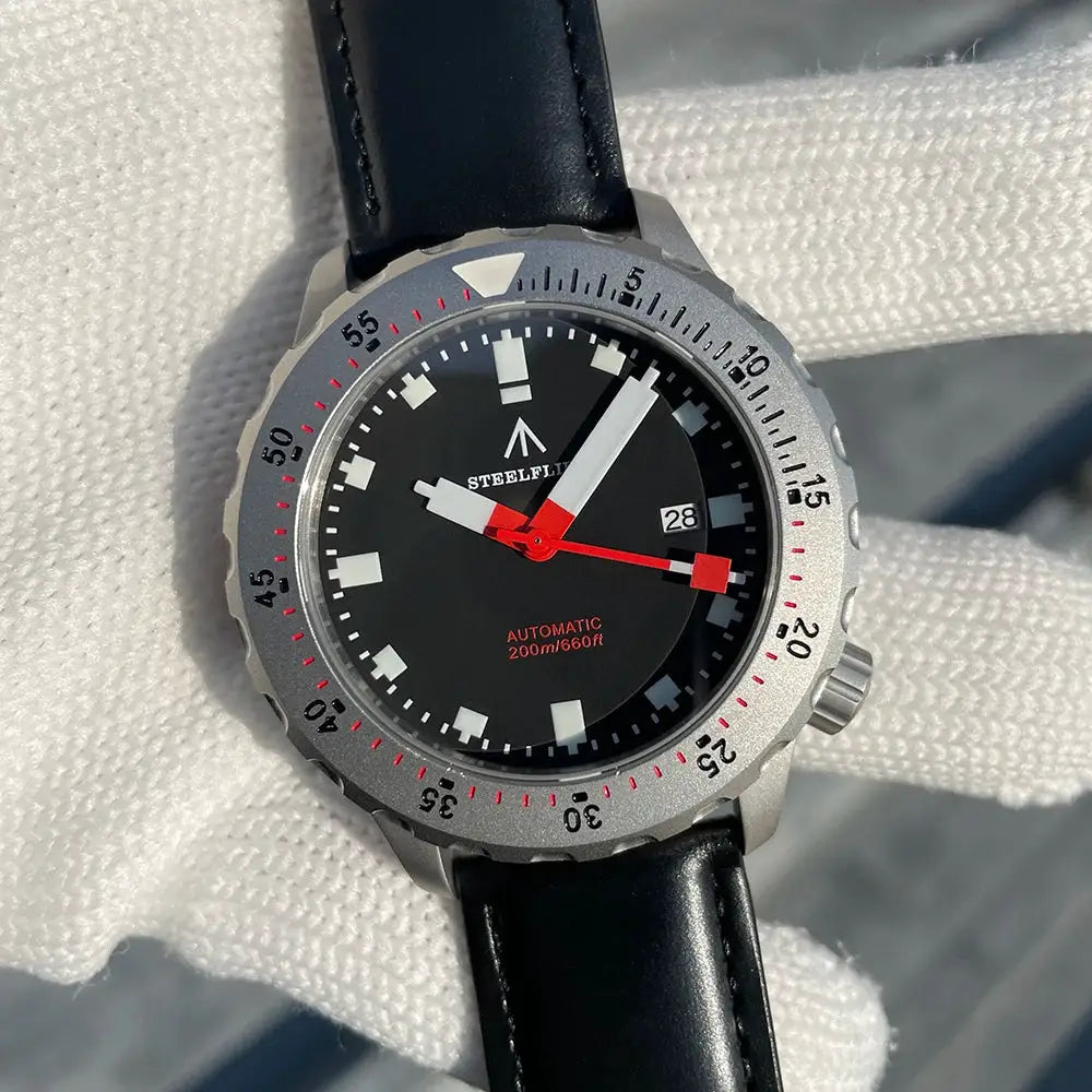 STEELFLIER SF752 dive watch with black dial, automatic movement, red second hand, date at 3, black leather strap