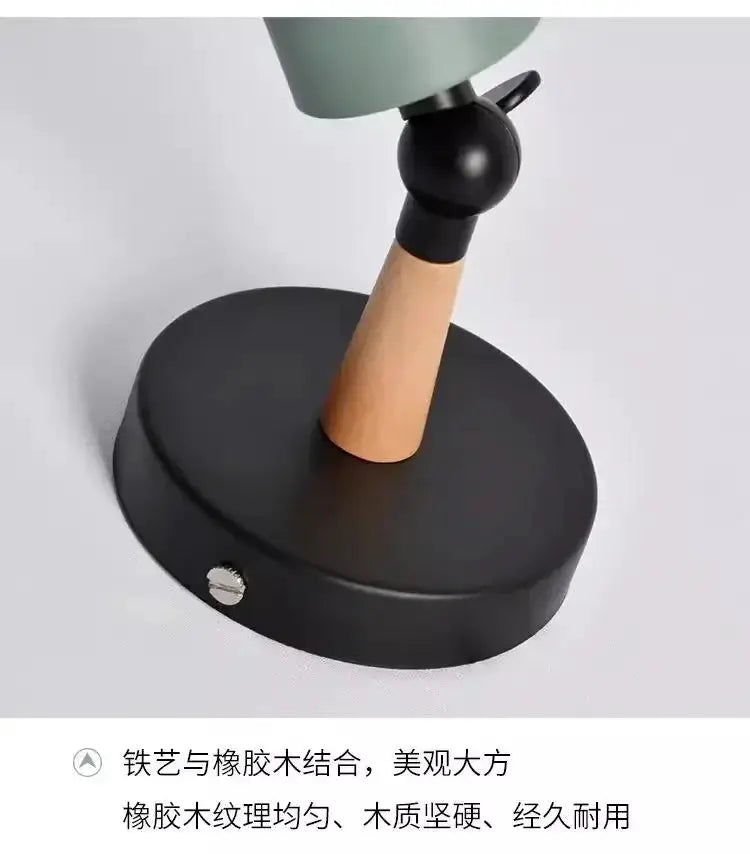 Nordic wooden LED wall lamp with round black base, natural wood stem and green shade